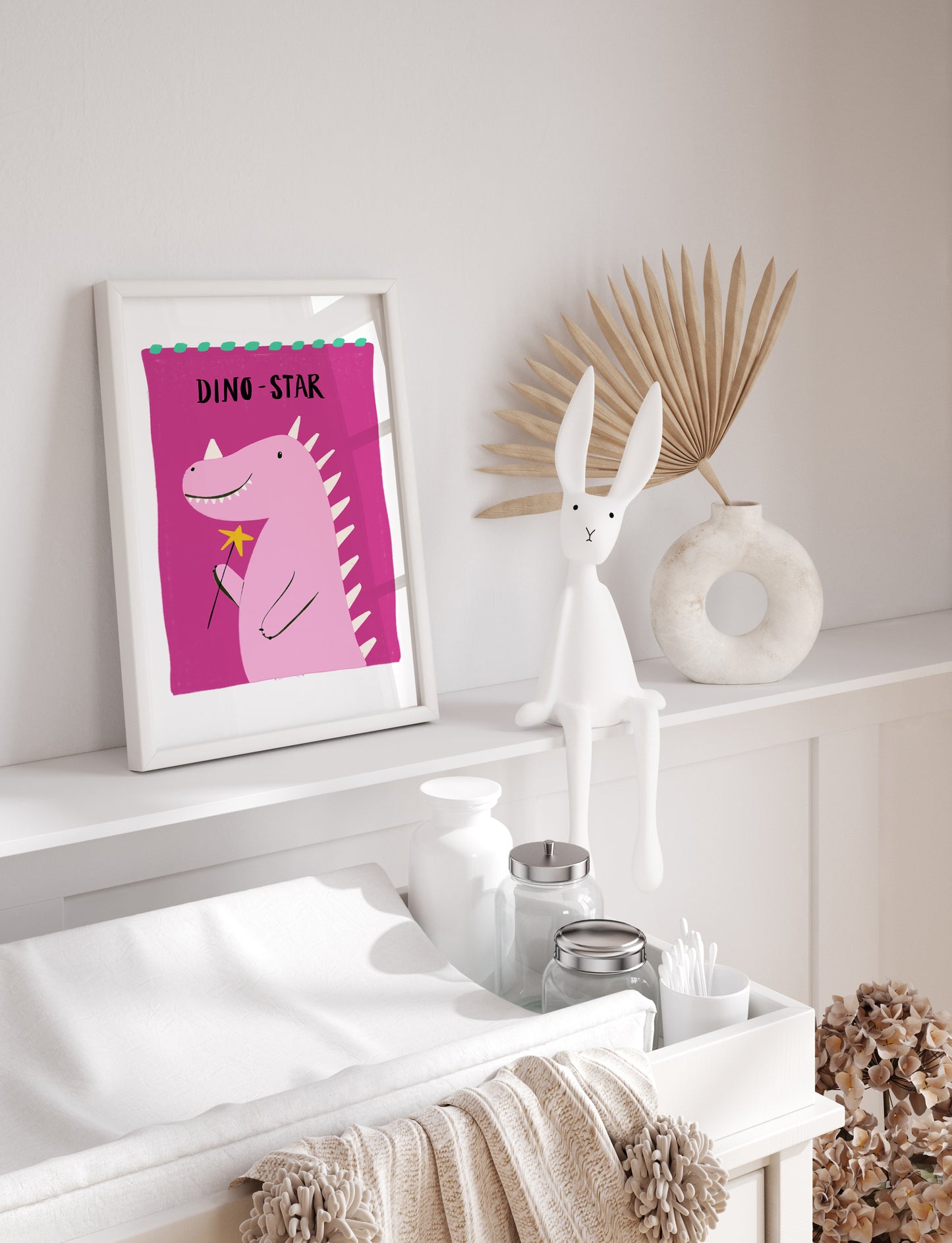 Framed dinosaur print on a shelf with decorative items