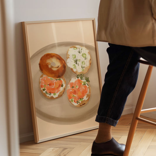 A warm and inviting kitchen art print of salmon and cream cheese bagels.