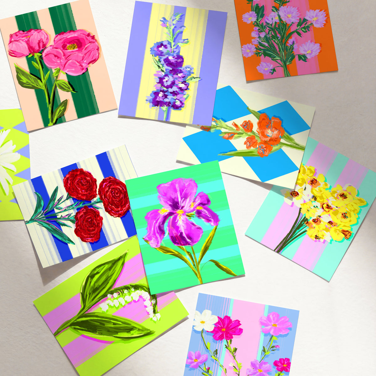 Colourful birth flower prints for different months arranged together with striped and patterned backgrounds