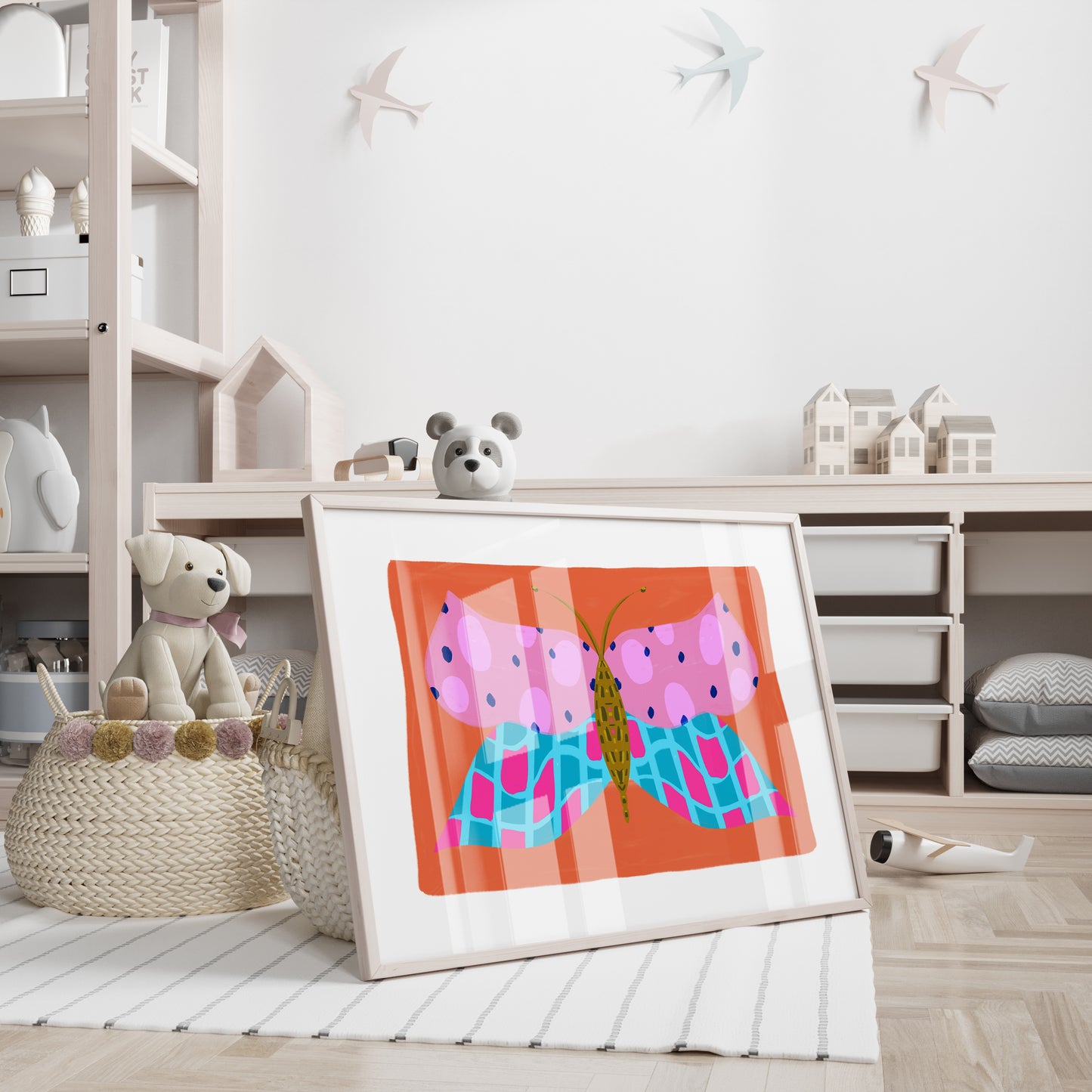 Framed artwork of a colourful butterfly on a shelf with toys in a child's room.
