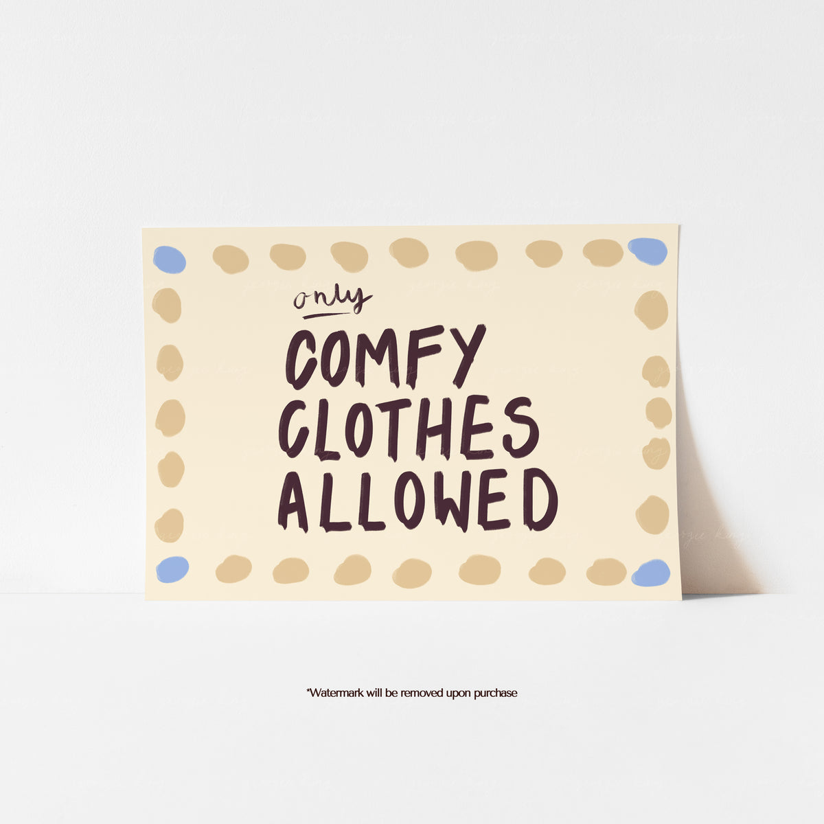 Only Comfy Clothes Allowed text art print with dark brown lettering on a cream background and painted spot border.
