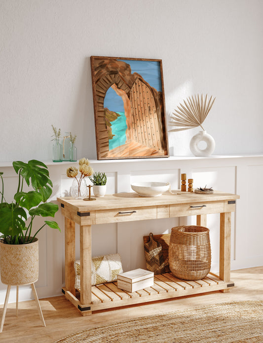 Rustic medieval doorway at Tintagel Castle overlooking Cornwall’s picturesque coastline and bright turquoise waters.
