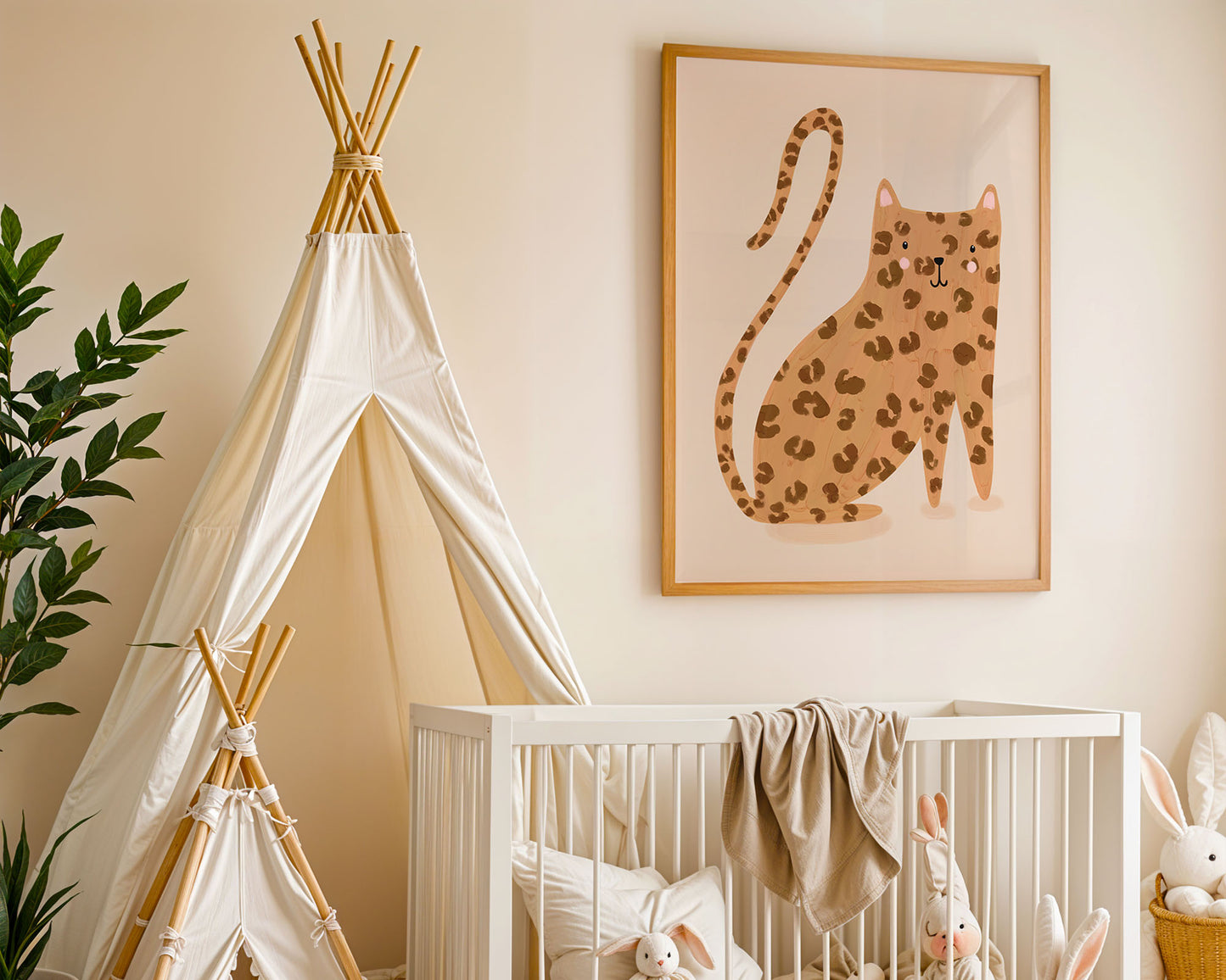 Baby bedroom with a leopard art print on the wall.