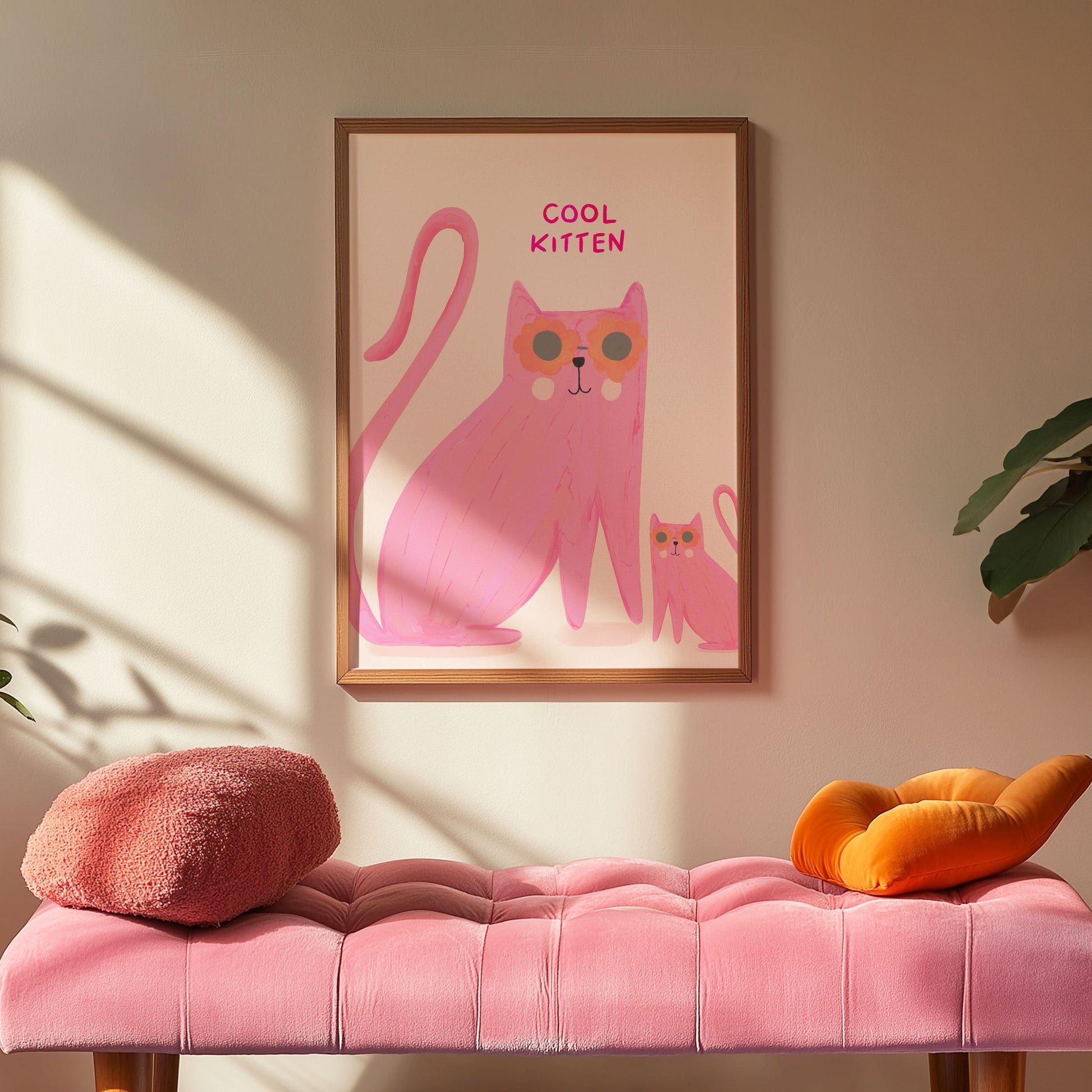 Framed artwork of a pink cat with sunglasses on a wall above a pink bench.
