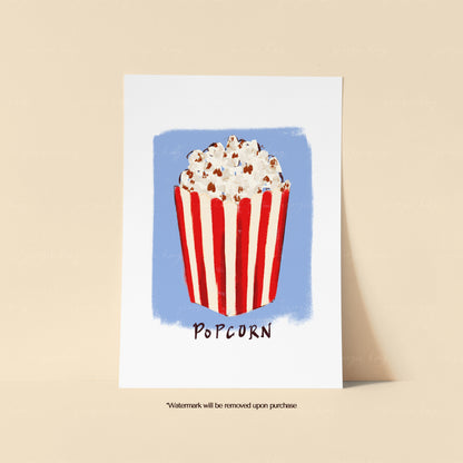 Popcorn art print with a red and cream striped popcorn box on a soft blue painted background.