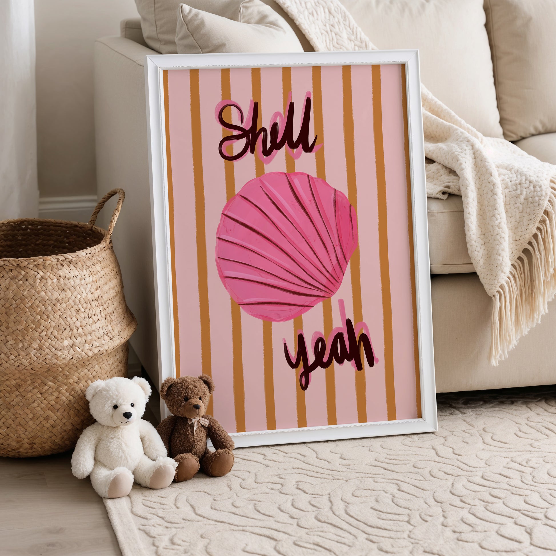 Framed artwork with a pink shell and text in a kids living room setting