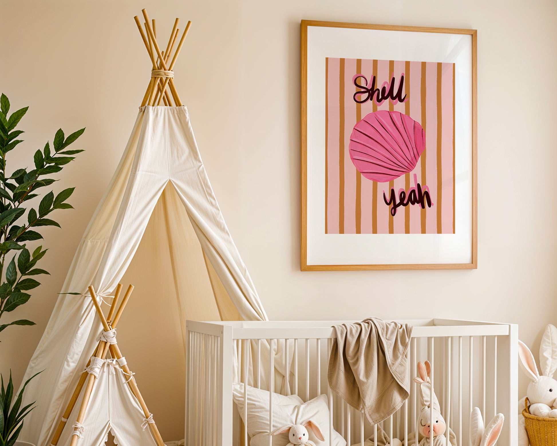 Nursery room with a crib, teepee, and framed artwork of a pink shell on the wall.